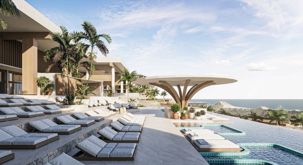 Infinity pool met zeezicht en tropische palmbomen bij TUI BLUE Cura&ccedil;ao